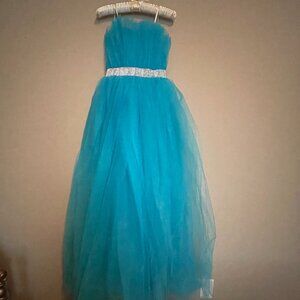 Size Zero, Turquoise, Strapless Tulle Prom Dress with a Belt of Rhinestones.